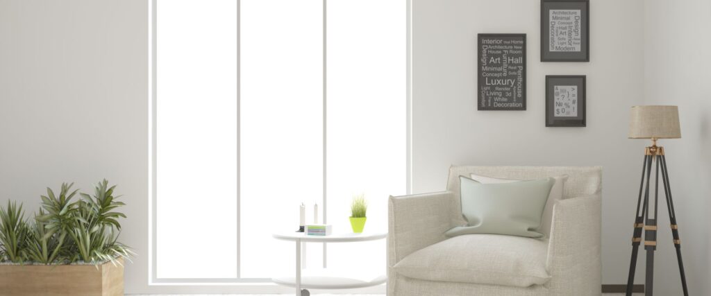 A bright modern living area with a lounge chair and reading lamp.