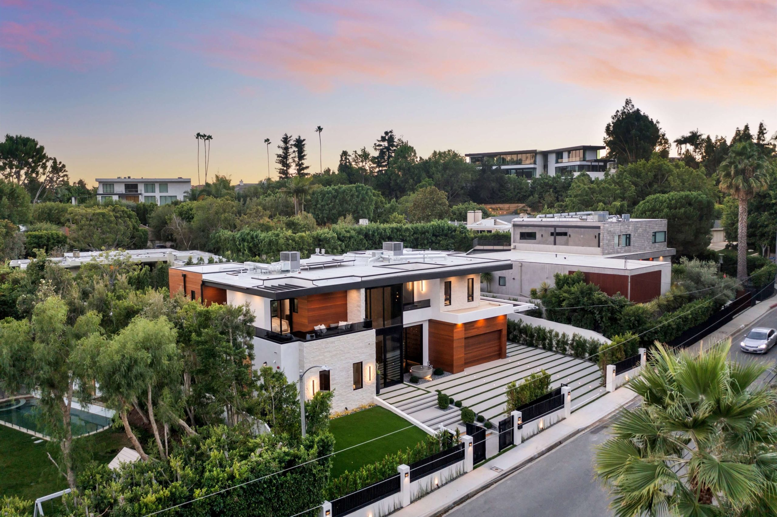 Modern luxury house aerial view at sunset | Featured Image for the The Cost of Building a Luxury Home - What to Expect blog on Collaborate Construction