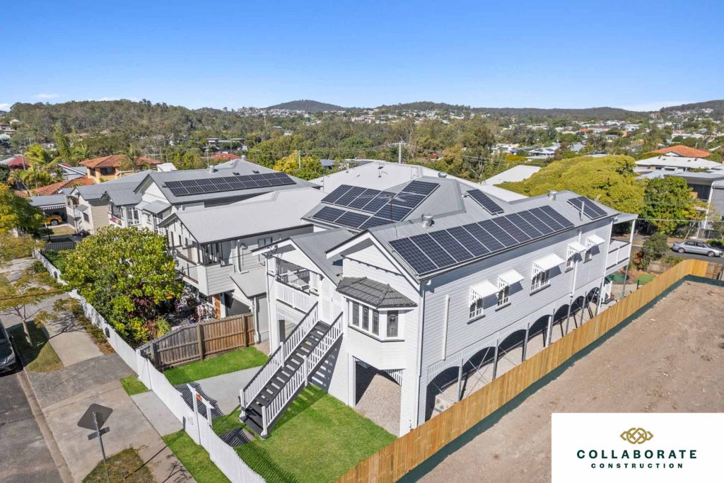Freshly renovated house featuring solar panels on the roof. | Featured image for the full house renovation company page of Collaborate Construction.
