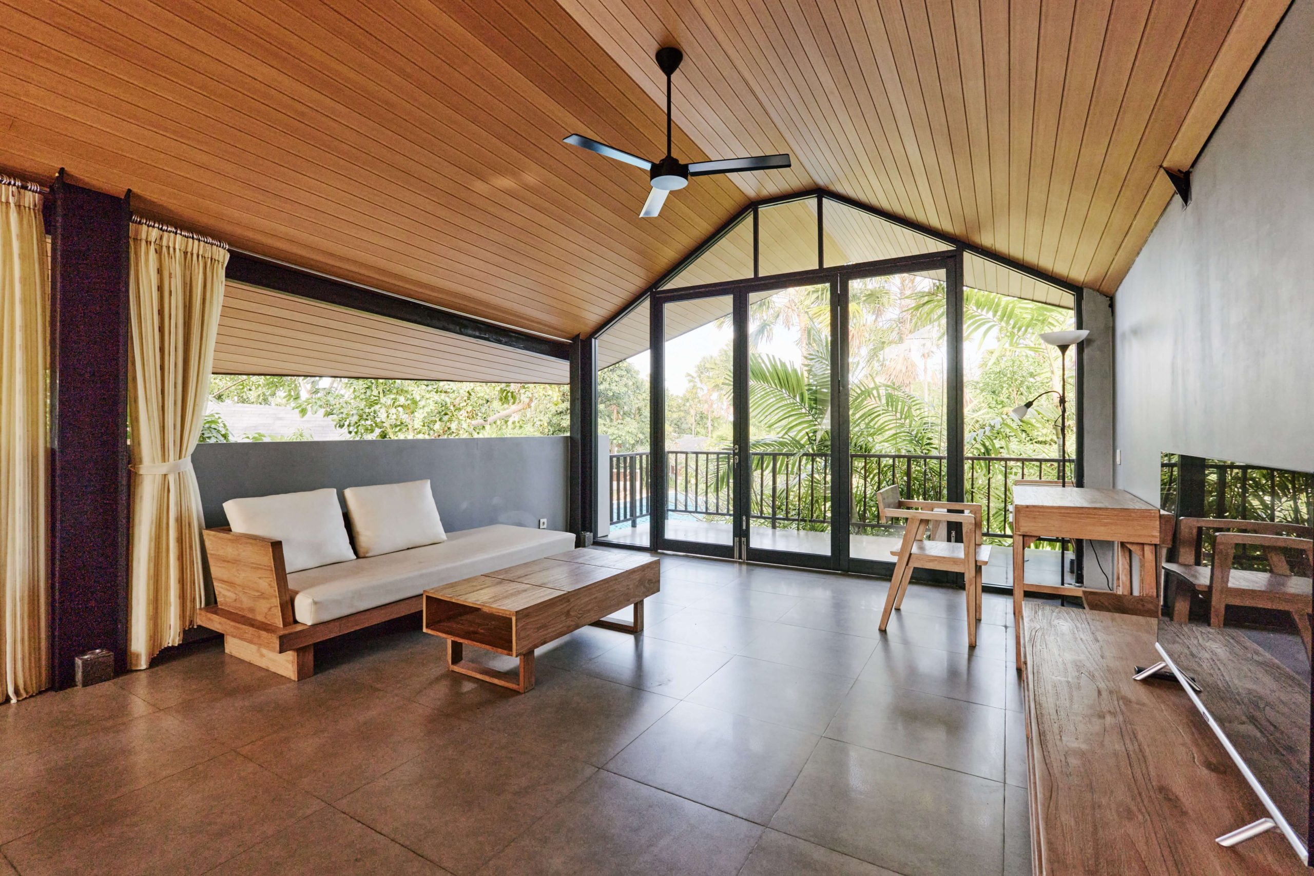 Interior garden summer patio built with sustainable materials | Featured Image for the Why Sustainable Luxury Homes Are the Future of Real Estate blog on Collaborate Construction.