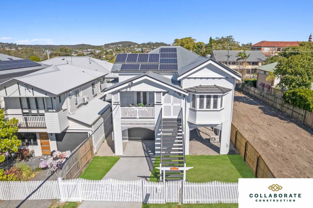 A residential home with solar panels on the roof | Featured Image for the Carport Builders & Garage Builders service landing page