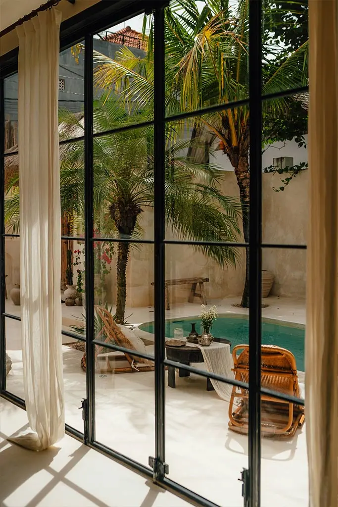 Tall French windows with curtains | Image for the House Renovations Brisbane Top Level Service page.