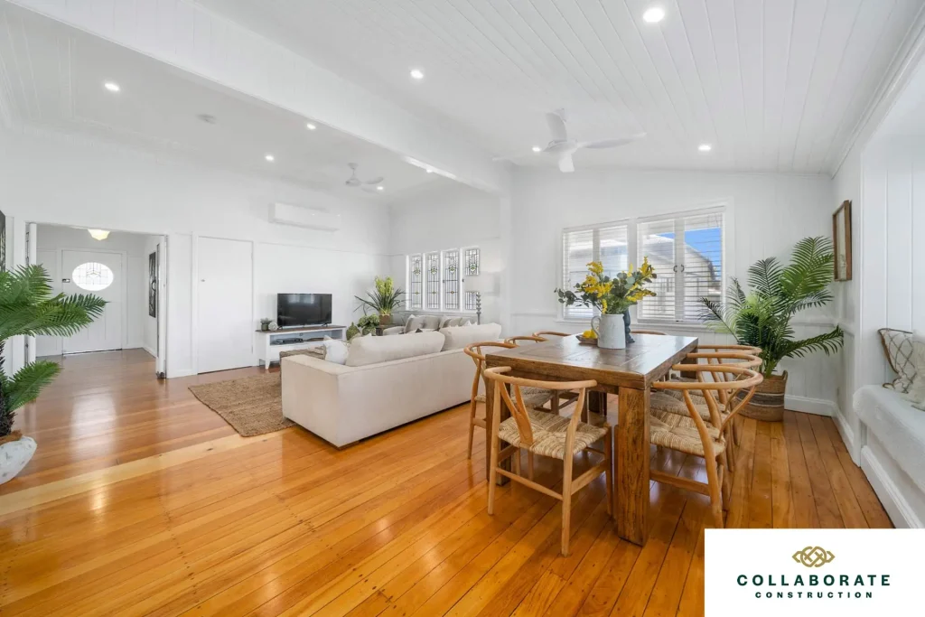 Living room with wooden floors and white walls | Image for the Brisbane Luxury Home Builders page.