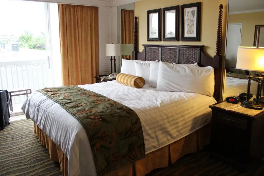 Upscale room with a large bed and a carpet on the floor | Image for the Rooming House Builders page.